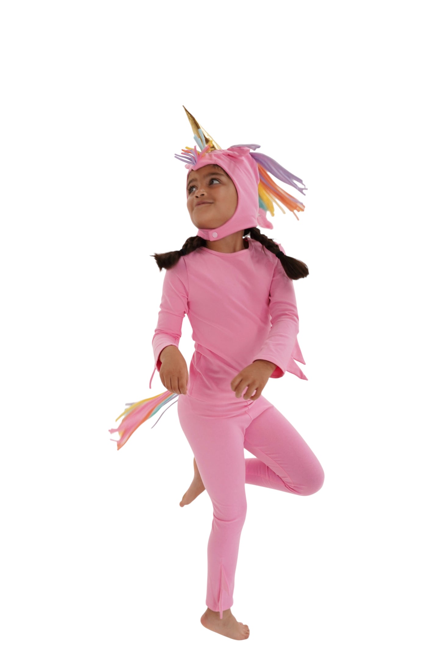Child in a pink unicorn costume with rainbow hair, pink unicorn pajama, rainbow unicorn.