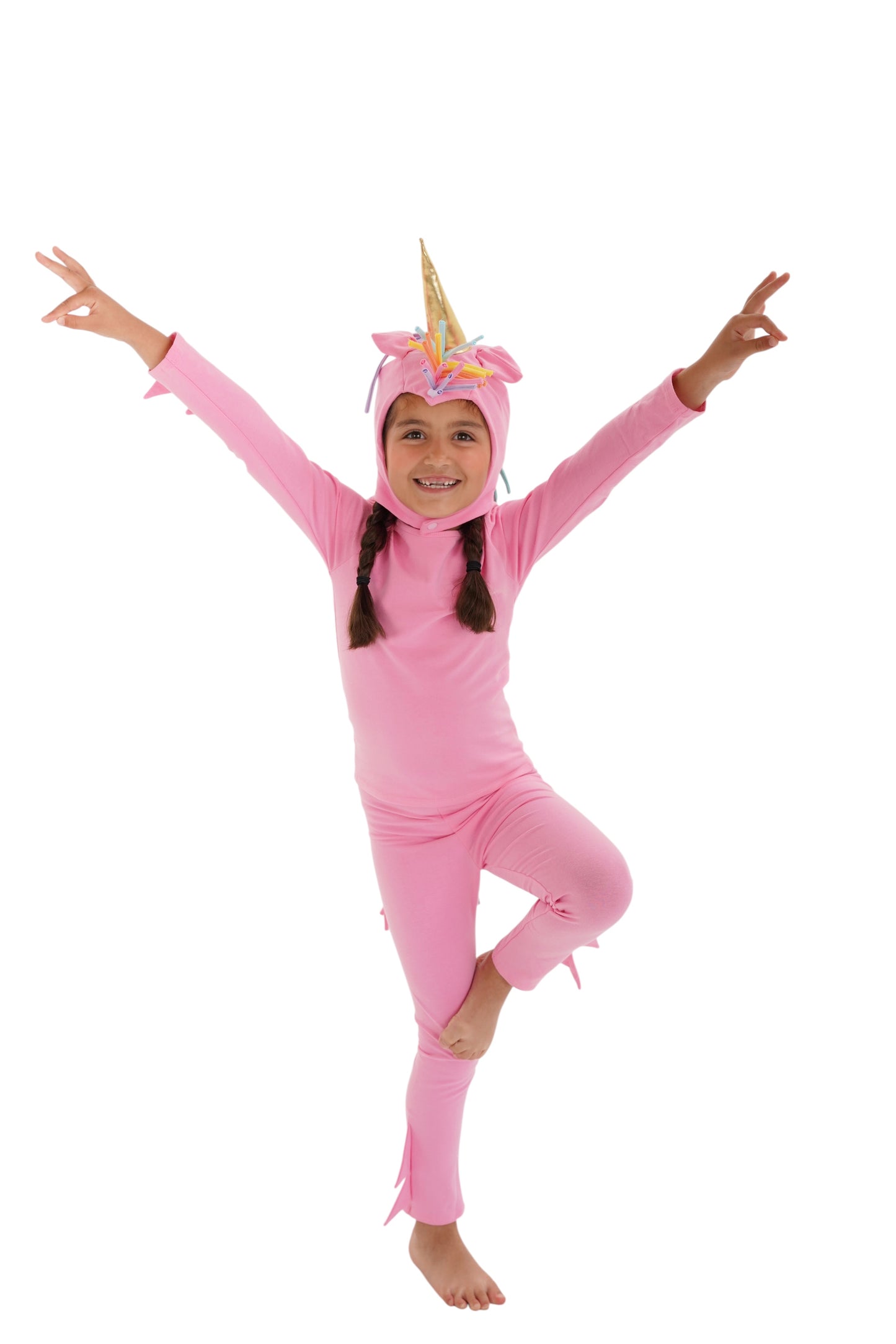 Child in a pink unicorn costume with rainbow hair, pink unicorn pajama, rainbow unicorn.
