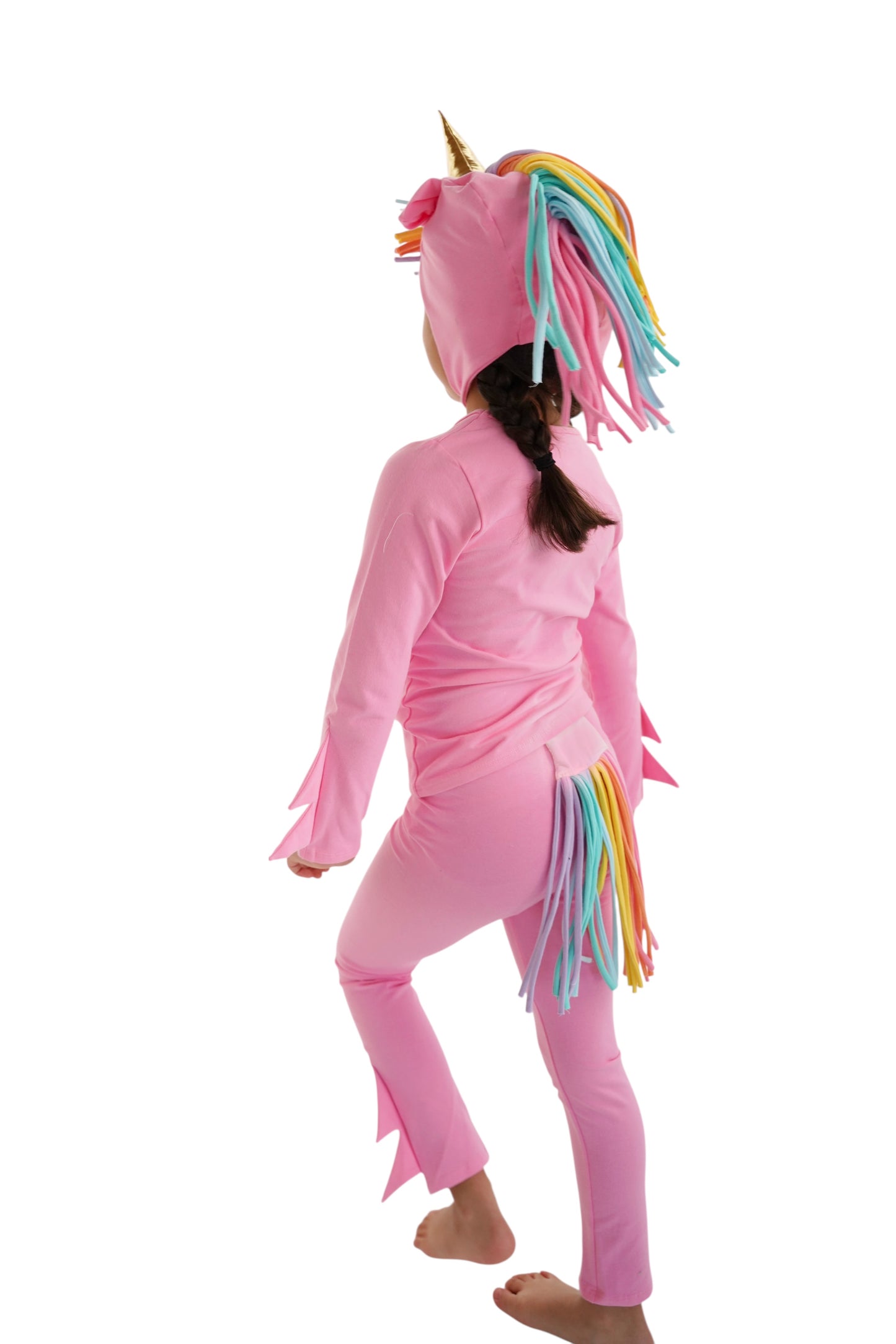 Child in a pink unicorn costume with rainbow hair, pink unicorn pajama, rainbow unicorn.