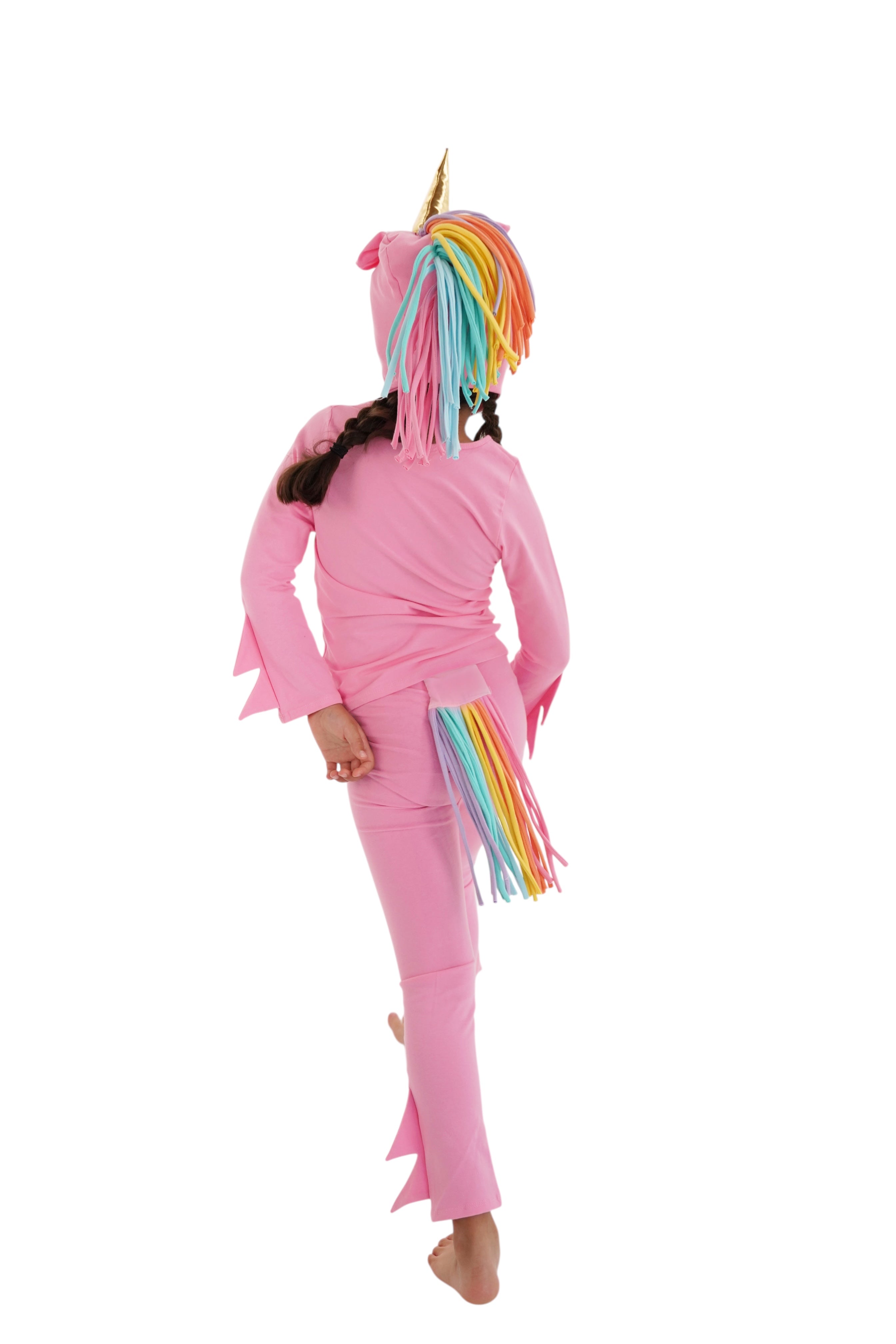 Child in a pink unicorn costume with rainbow hair, pink unicorn pajama, rainbow unicorn.