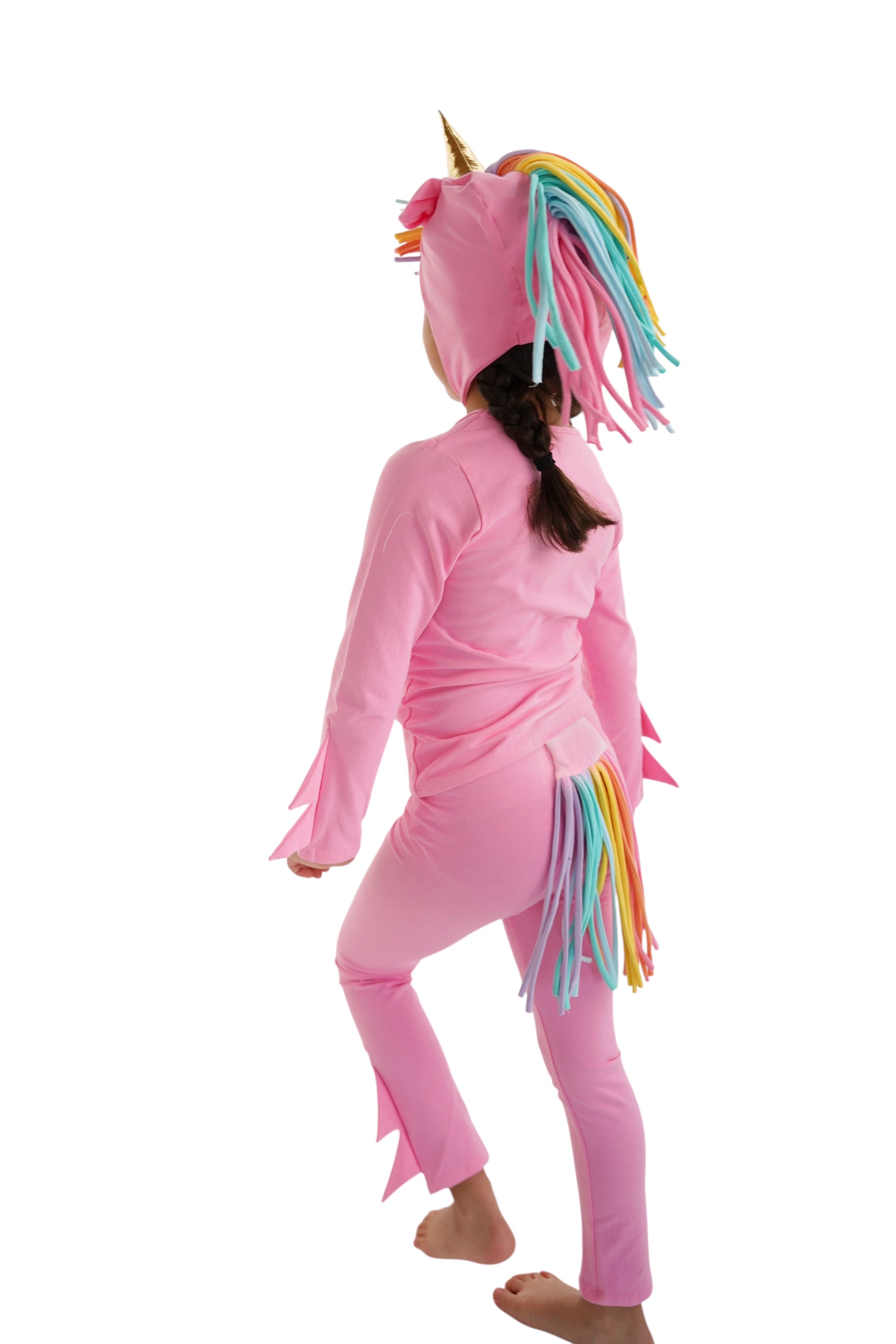 Child in a pink unicorn costume with rainbow hair, pink unicorn pajama, rainbow unicorn.