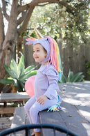 Toddler wearing a soft purple unicorn costume for dress-up and Halloween
