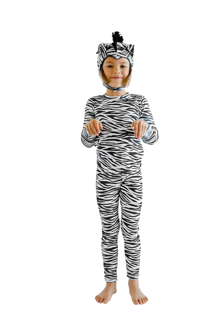 Child modeling a zebra Halloween costume on a white background
